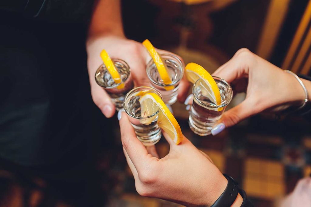 Friends-toasting-with-shot-glasses